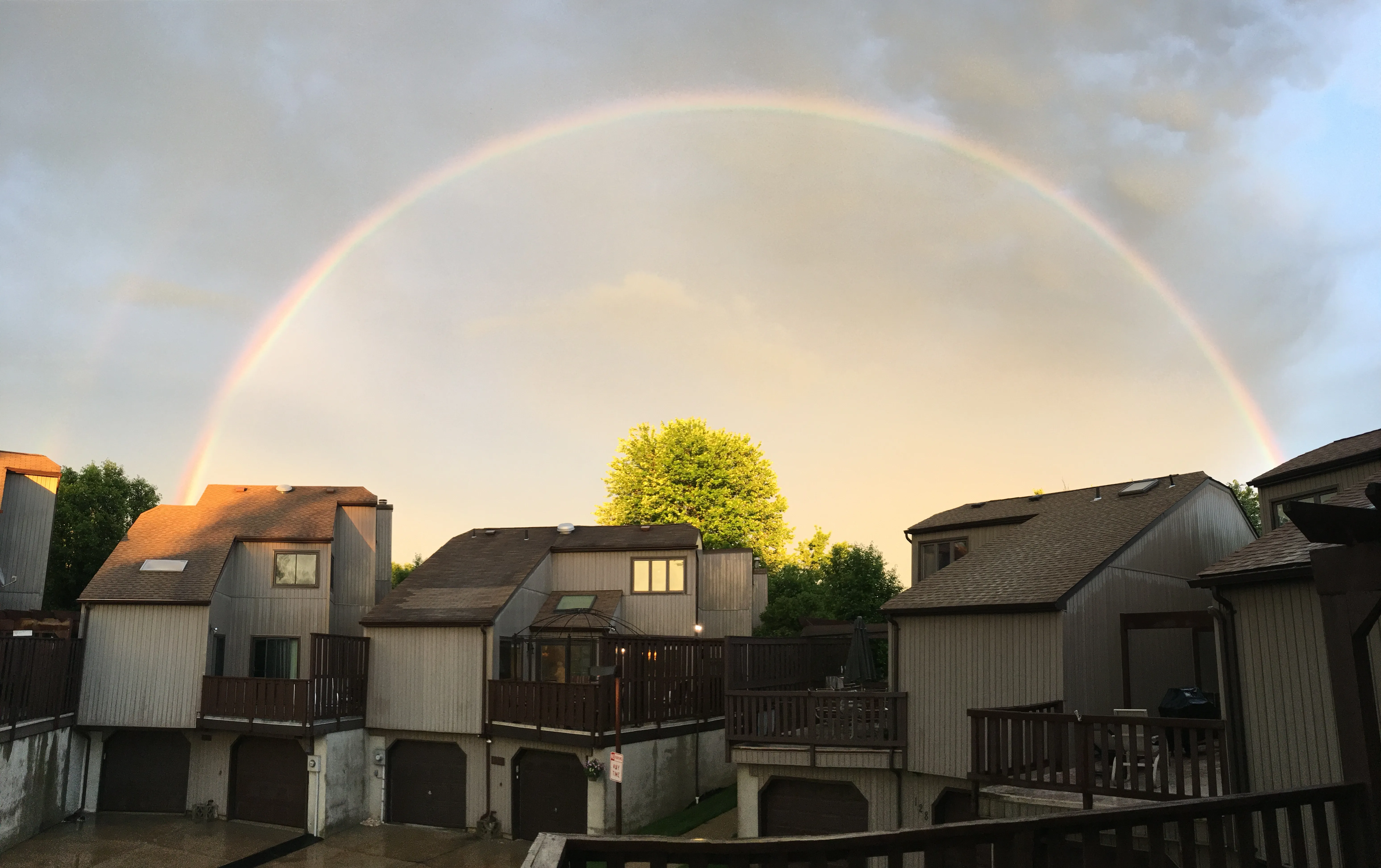 A rainbow arching over the Foxborough Village townhomes after a summer storm.